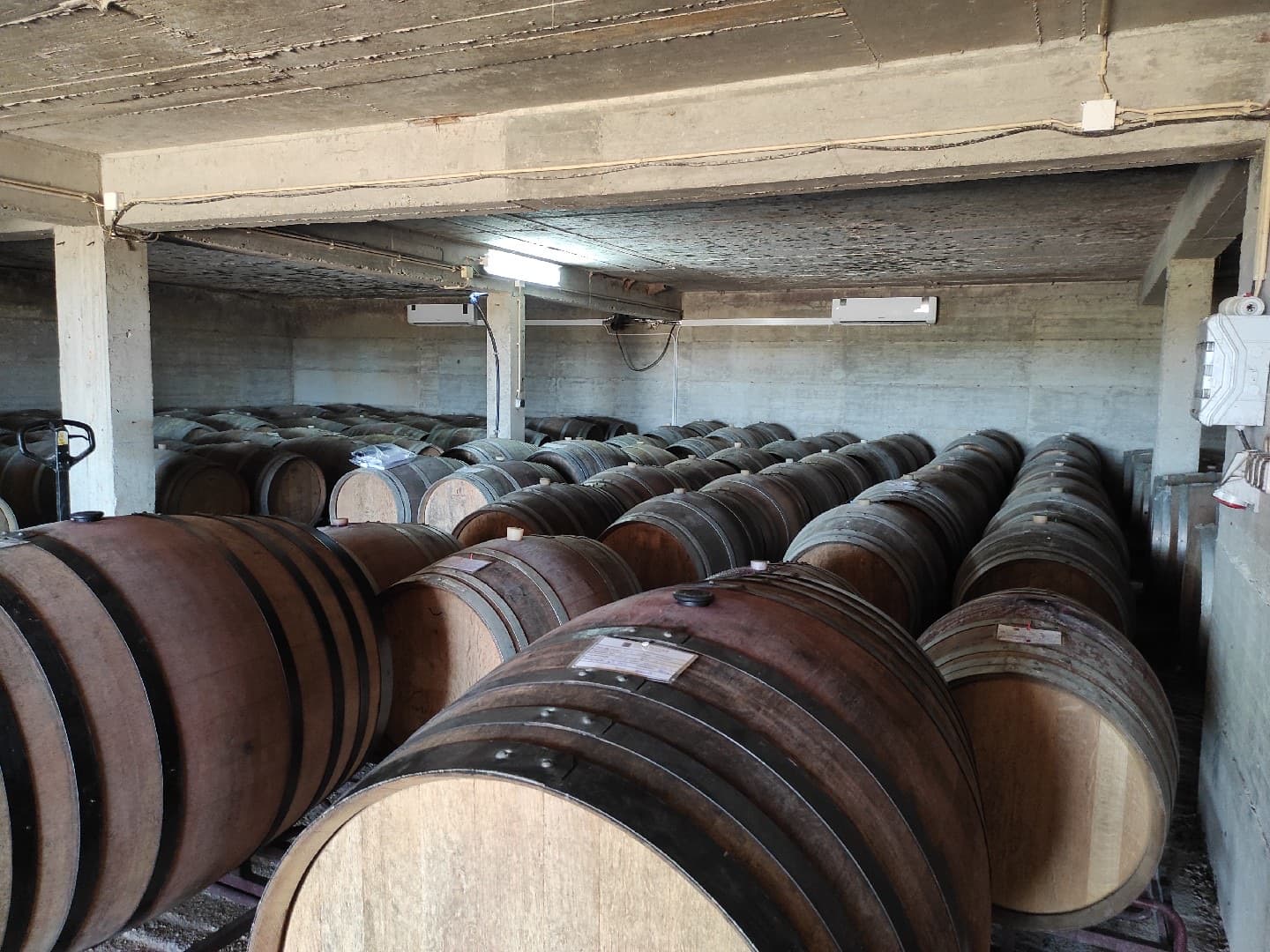 Wide view of a wine cellar with air conditioning systems installed