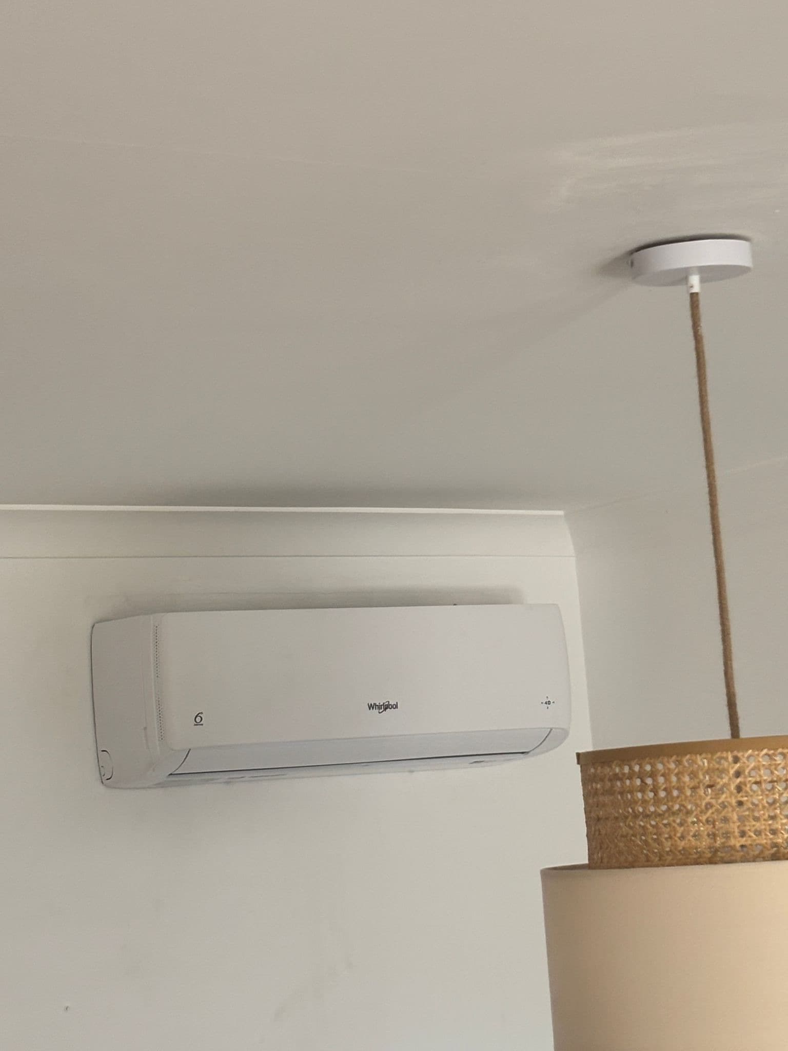 Whirlpool indoor air conditioning unit installed on a wall